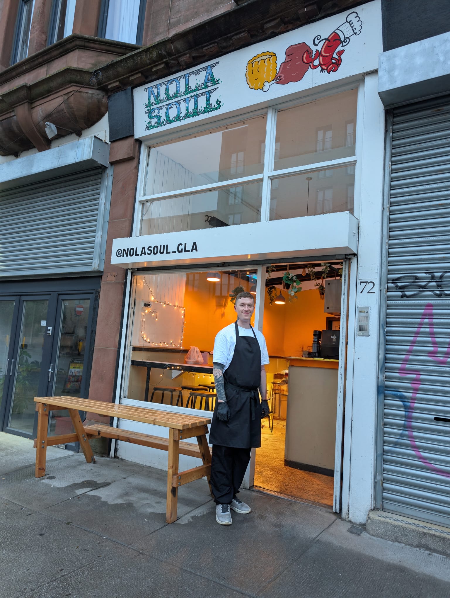 Matthew, owner and chef, outside NOLA Soul at 72 Victoria Road